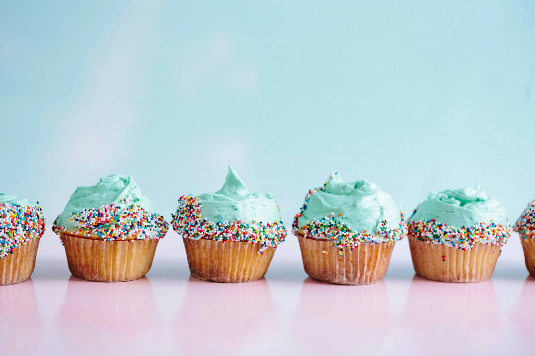 cupcakes with blue icing and sprinkles