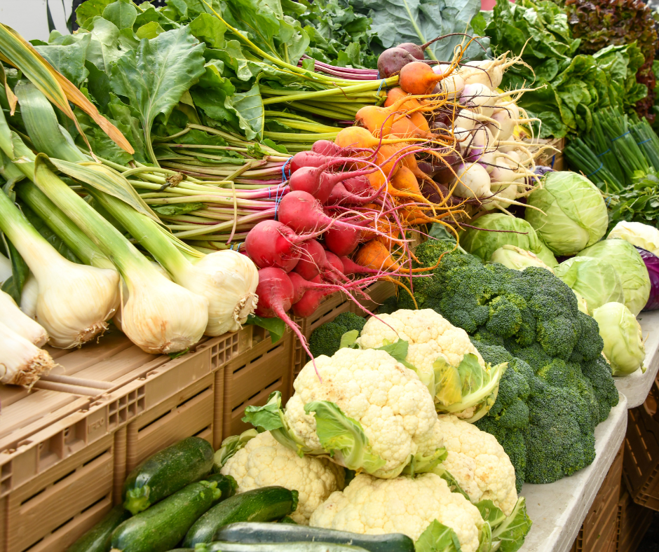 Lots of vegetables laying out on crates