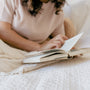 woman reading in bed