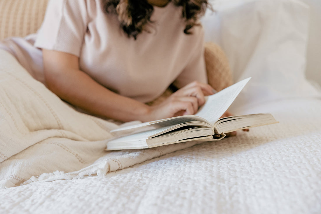 woman reading in bed