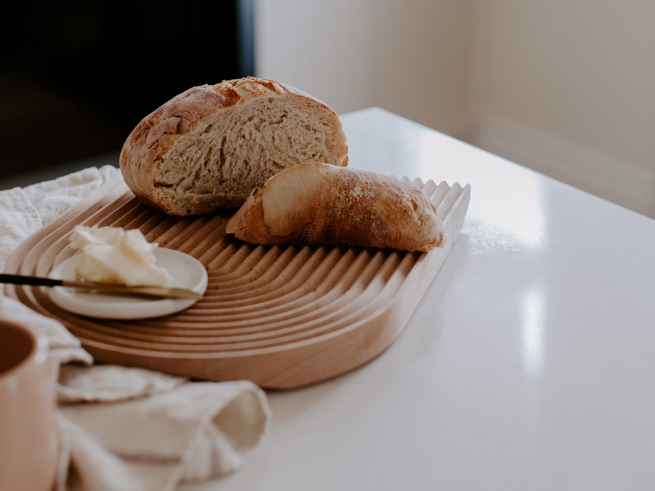 bread and butter on cutting board